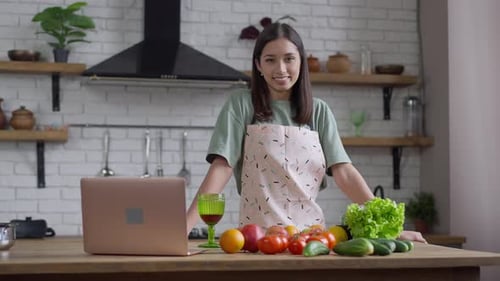 Woman in Kitchen with Fruits and Vegetables
