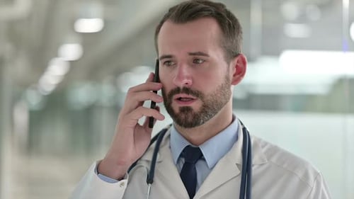 Doctor Talking on Smartphone in Modern Hospital