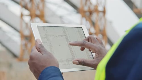 Close Up of Engineer Looking at Blueprint