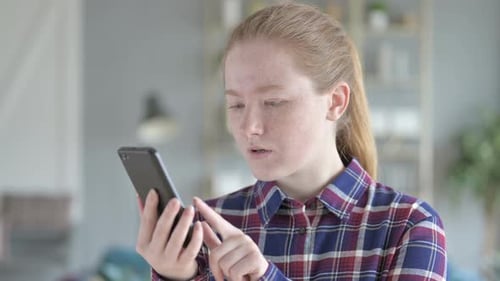 Surprised Woman Using Smart Phone