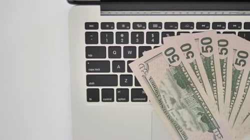 Top View of Dollars on Keyboard of Laptop, Business Concept