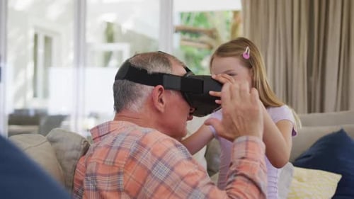 Grandfather and Granddaughter Experience Virtual Reality Headset