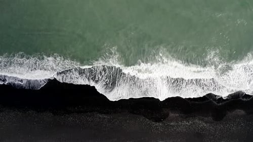 Reynisfjara Black Sand Beach In Iceland - aerial top down
