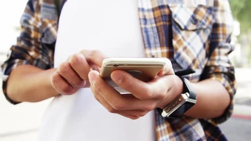 Close up view of a man texting on his smartphone