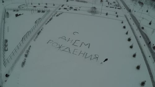 Aerial View of Winter Park With Message in Snow