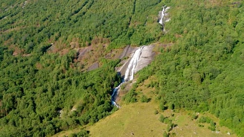 Waterfall in the mountain with trees