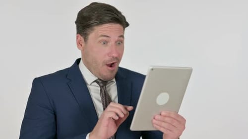 Adult Man Excitedly Using Tablet Device