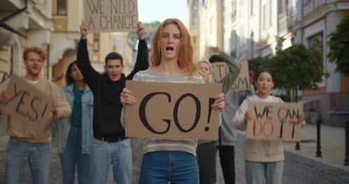 Group of People Protesting in City Street