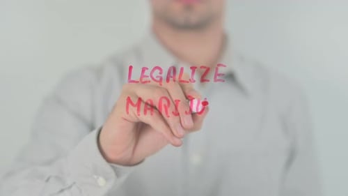 Writing Legalize Marijuana Message With Red Marker