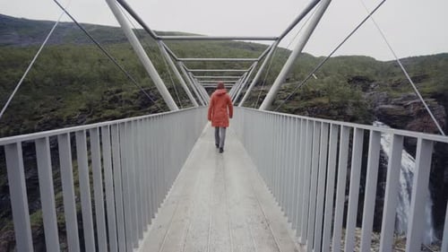 Man walking on bridge