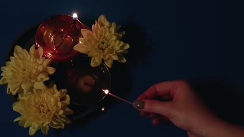 Lighting a Diya Lamp for Diwali Celebration