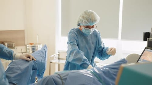 In the Hospital Operating Room Diverse Team of Professional Surgeons and Nurses