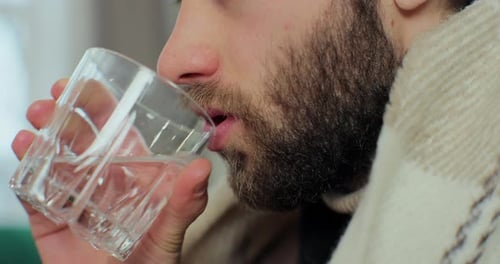 Man Drinking Water Close Up Inside During Day