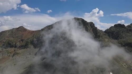 Aerial View of Rocky Mountains with Clouds
