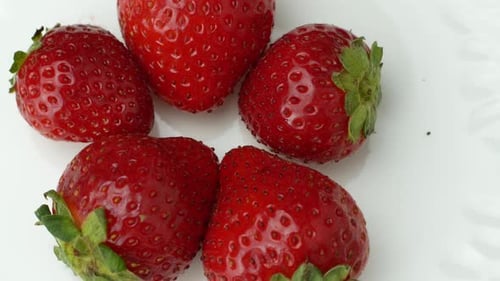 Fresh Red Strawberries Close-Up on White Background