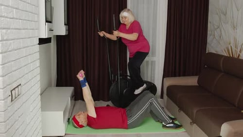 Elderly Couple Exercising at Home