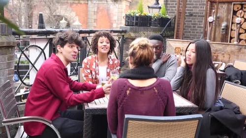Friends Talking Outside Restaurant