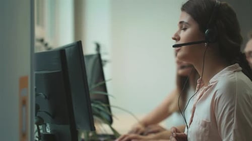 Call Center Operator Talking with Client Woman Working at Call Centre