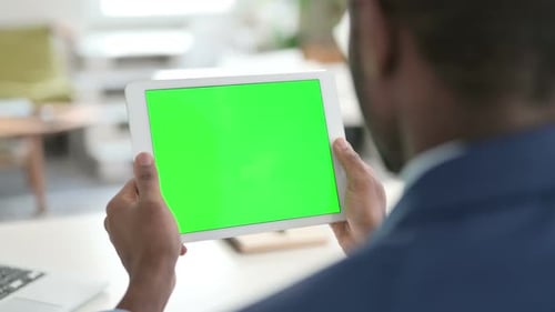 Businessman Using Tablet with Green Chroma Key Screen