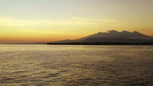 Wide angle overhead abstract shot of a paradise sunny white sand beach and aqua blue ocean background