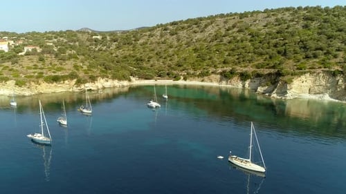 Aerial view group of boats anchored on mountain shore, Greece.