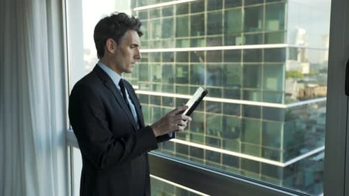 Businessman using digital tablet in office