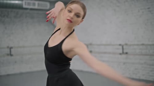 Elegant Ballerina Dances in Dance Studio