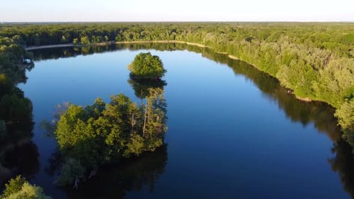 Beautiful landscape, Forest woods and tranquil lake.
Calm aerial view flight panorama overview drone