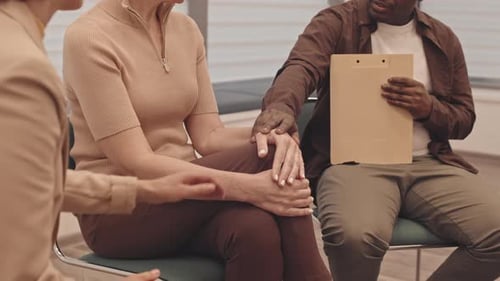 Adults Support One Another in a Counseling Session