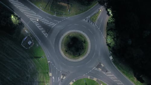 Time Lapse of a Roundabout at Night with Vehicles and Traffic