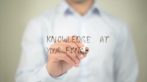 Knowledge at Your Fingertips Man Writing on Transparent Screen