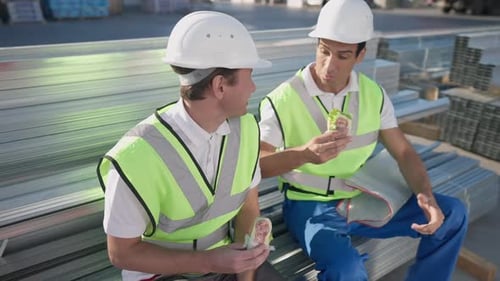 Construction Workers Taking a Lunch Break on Metal