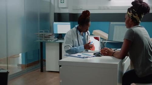 Doctor Explains Heart Anatomy to Patient Using Tablet