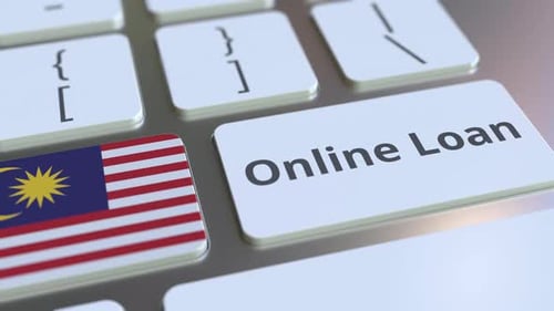 Online Loan Text and Flag of Malaysia on the Keyboard