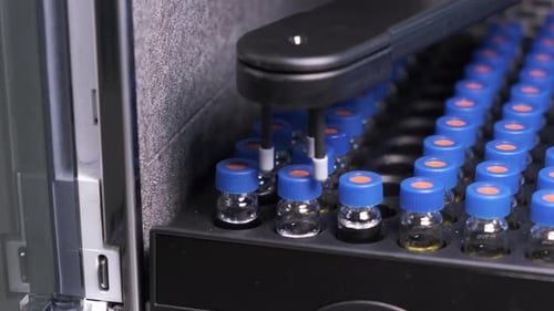 Automated Lab Machine Fills Vials With Fluid