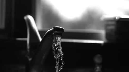 Water pouring from a faucet in ultra slow motion 1500fps on a reflective surface - WATER FAUCET