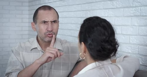 Man Telling Woman to Be Quiet During Argument