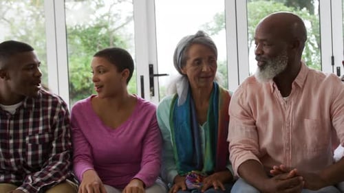 Multigenerational Family Smiling Together on Couch