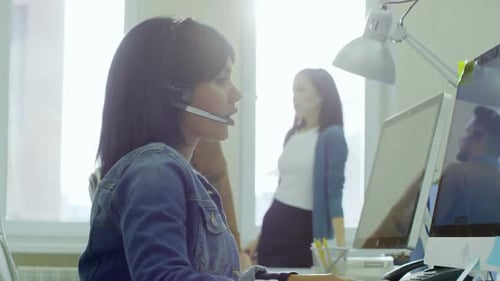Young Female Call Centre Operator Working
