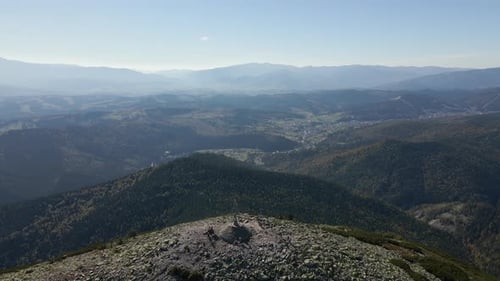 Aerial Landscape View of High Peaks with Dark Pine Forest Trees in Wild Mountains