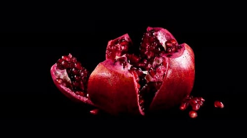 Vibrant Pomegranate Fruit Close-Up on Black Background