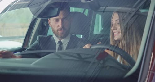 Salesman Showing Female Client Salon of New Modern Car