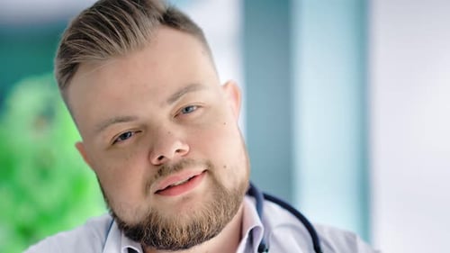 Friendly Doctor Smiling Close Up in Hospital