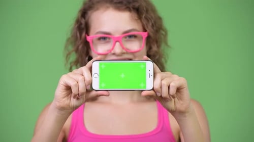 Woman Holds Phone with Green Screen for Chroma Key
