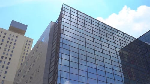 Modern Office Building with Glass Exterior on Sunny Day