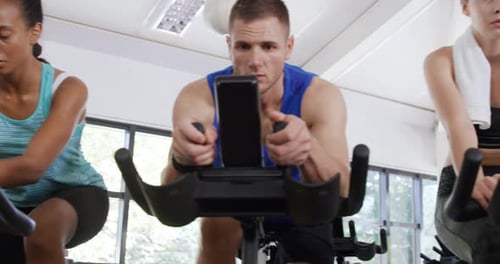 Working out on exercise bikes at a gym