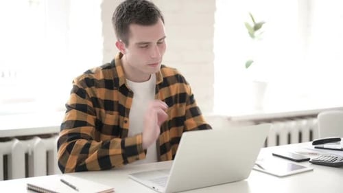 Adult Typing on Laptop Massages Stiff Neck