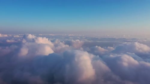 Aerial View of White Puffy Clouds at Sunset
