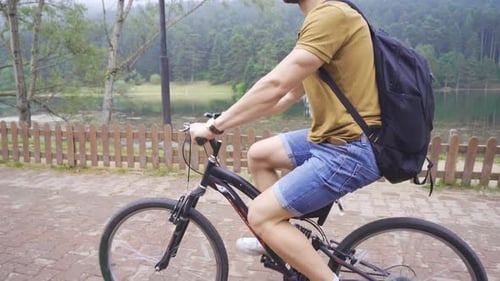 The free man is riding a bicycle.