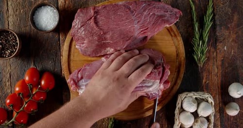 Preparing Meat On Wooden Cutting Board